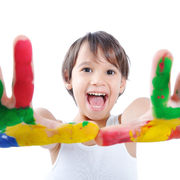 A little cute child with colors on white